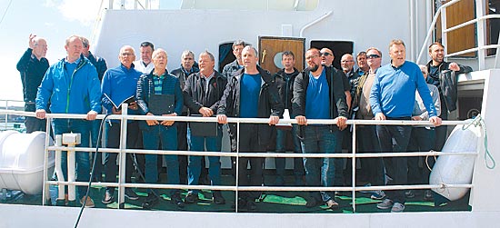 The Giske Men’s choir rehearsing for their cathedral performance on board the Haugefisk at Kirkwall harbour. (Craig Taylor)