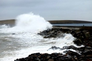 Waves sweeping over the second Churchill Barrier in winter. (Picture: Craig Taylor)
