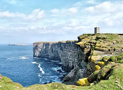 The Kitchener Memorial, on Marwick Head, with the Brough of Birsay in the background. (Sigurd Towrie)