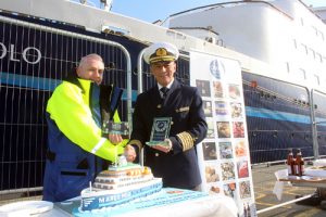 Plaques being exchanged to mark the visit of the ship.