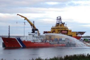 The Coastguard tug, which has powerful hoses either side, pictured next to the Subsea Viking.  (Picture: Jim Delday)