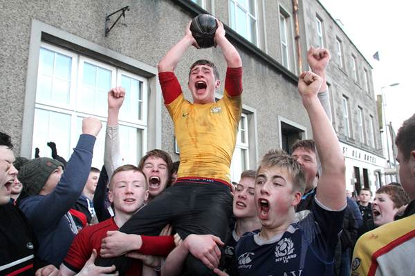 Fifteen-year-old Harry Siderfin is held aloft with his trophy. (www.theorcadianphotos.co.uk)