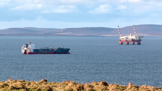 Clamor Schulte in Scapa Flow this week taking fuel from the tanker Vadero Highlander . (Picture: Magnus Budge)
