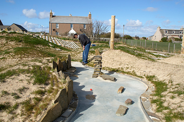 David Woodcock plays the 'Old Man of Hoy' hole at Burray's crazy golf course — Britain's most northerly.