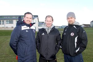 Karl Adamson, assisted by Alex Leonard (left), Kevin Groundwater (right), and Graeme Hamilton (missing) is preparing to make his bow in the dugout for Orkney this weekend.