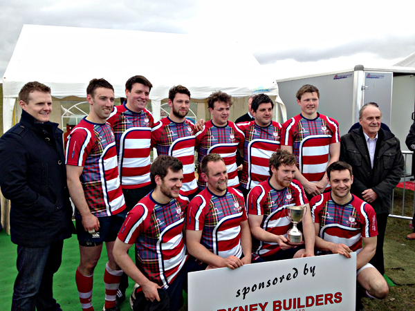 Pictured alongside Stephen Kemp (left) and Charlie Kemp (right) of sponsors Orkney Builders Contractors Ltd, Peebles won a first Sevens title since 2008.