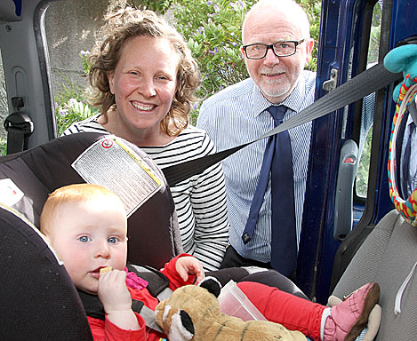Councillor Andrew Drever is urging anyone driving young children about to get their car seats checked at the Good Egg clinic on August 17. He’s pictured here with Esme Jarvis and her mummy, Beck.