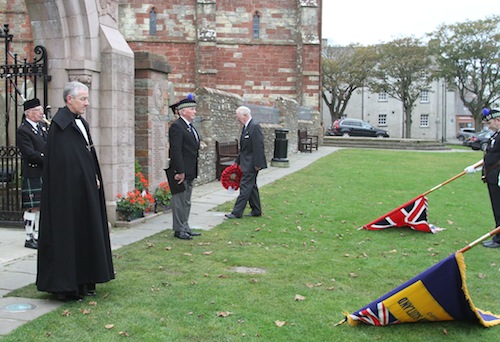 President of the Kirkwall branch of the Royal British Legion, Bryan Taylor laying the wreath at the Kirkwall war memorial. Also pictured are branch chaplin David Dawson, branch chairman Eddie Ross and piper Brian Findlay. On the left are the legion branch's colour party Steve Davis and Albert Garriock.