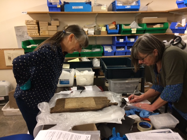Dr Alison Sheridan and archaeology curator Gail Drinkall examine the carving.