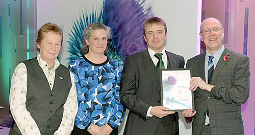 Pictured, from the left: Shona Turnbull (Highland Council), Tracy McCollin (Marine Scotland) and James Green (Orkney Islands Council) receiving the award from Minister for Local Government and Housing, Kevin Stewart MSP.