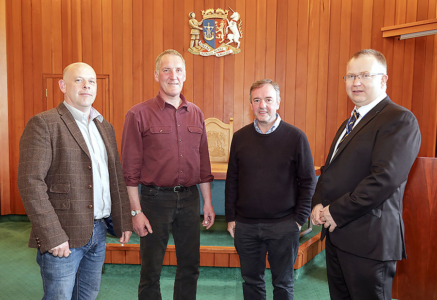 Stromness and South Isles Councillors Magnus Thomson, Rob Crichton, and James Stockan with deputy returning officer Gareth Waterson. (theorcadianphotos.co.uk)